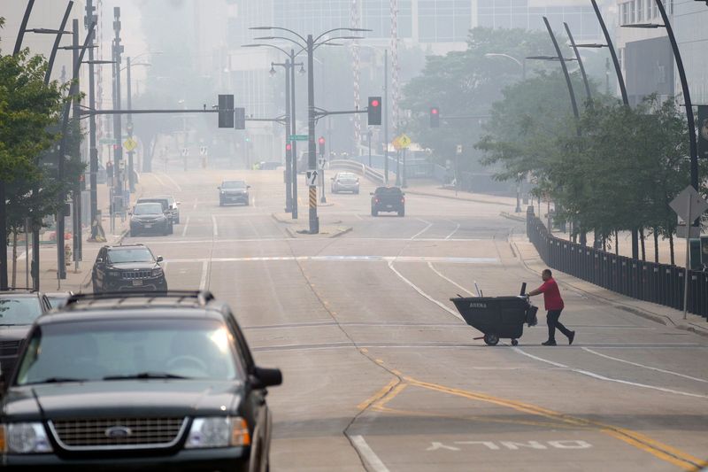Smoke fills downtown Milwaukee on W. Juneau Ave. on July 16, 2026 resulting from Canandian fires. There is an air quality alert for all of Wisconsin.