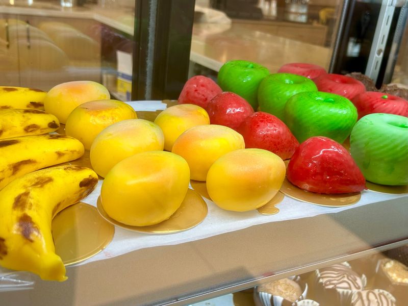 Viral fruit mousse cakes, like the kind sold at Haraz Coffee House in Oak Creek, are lifelike recreations of real pieces of fruit.