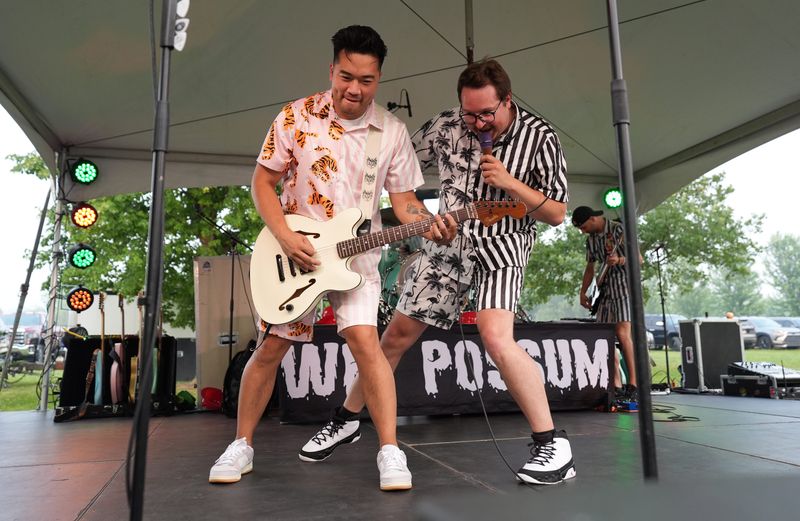 Lead singer Zach Hibbard, right, and backup rhythm guitarist Jon Tabers-Kwak perform with Wet Possum on July 18 at the Greenleaf Fireman's Picnic in Greenleaf.