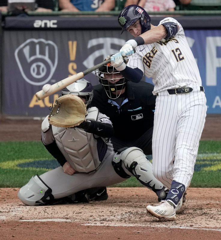 Milwaukee Brewers shortstop Cooper Pratt (12) hits a two-run double during the sixth inning of their game against the Colorado Rockies Sunday, July 26, 2026 at American Family Field in Milwaukee, Wisconsin.