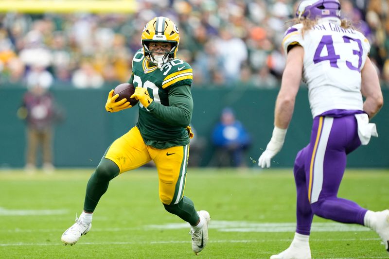 Nov 23, 2025; Green Bay, Wisconsin, USA; Green Bay Packers running back Chris Brooks (30) runs after the catch against the Minnesota Vikings during the first half at Lambeau Field. Mandatory Credit: Kayla Wolf-Imagn Images