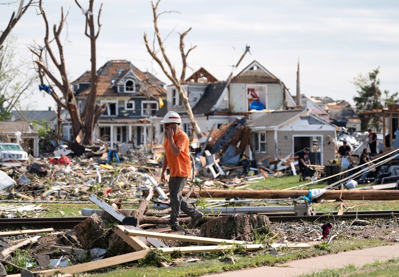 A worker assesses a railroad line following severe weather, including a tornado Monday, July 27, 2026, in Menasha, Wisconsin. Dan Powers/USA TODAY NETWORK-Wisconsin