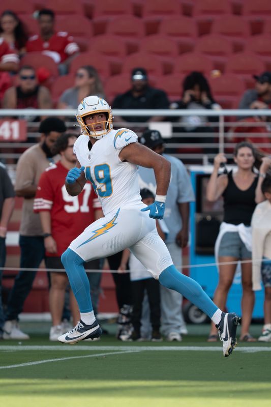 August 23, 2025; Santa Clara, California, USA; Los Angeles Chargers tight end Thomas Yassmin (49) warms up before the game against the San Francisco 49ers at Levi's Stadium. Mandatory Credit: Kyle Terada-Imagn Images