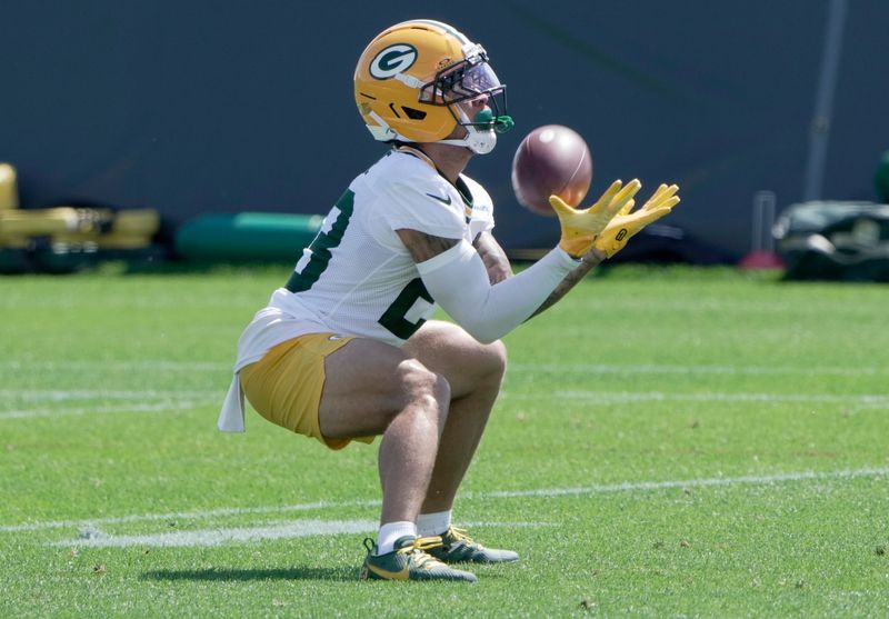 Green Bay Packers wide receiver Skyy Moore fields a punt during training camp.