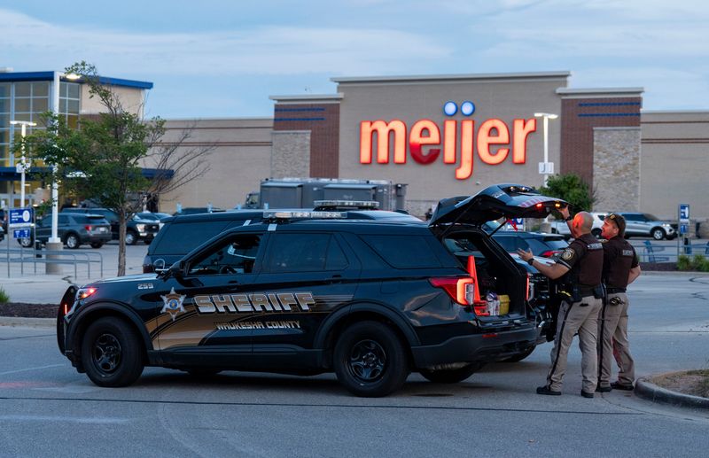 Waukesha County sheriff officers are seen blocking the entrance to the parking lot of the Meijer store in Waukesha, Wisconsin on July 30, 2026.