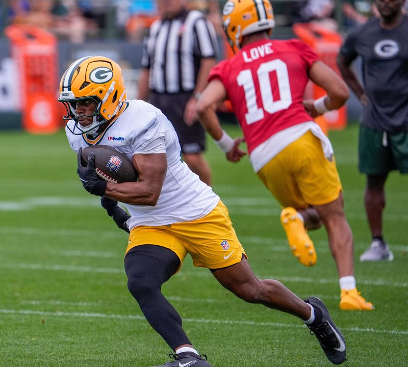 Green Bay Packers running back MarShawn Lloyd (32) runs through a drill during practice on Friday, July 31, 2026, at Ray Nitschke Field in Ashwaubenon, Wisconsin.
