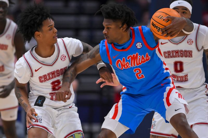 Mar 13, 2026; Nashville, TN, USA;  Alabama Crimson Tide guard Aden Holloway (2) guards Mississippi Rebels guard AJ Storr (2) during the first half at Bridgestone Arena. Mandatory Credit: Steve Roberts-Imagn Images