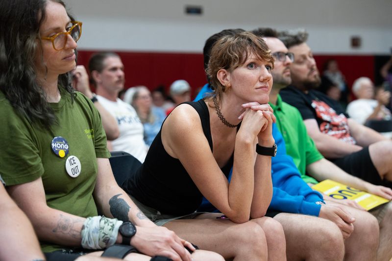 Erin Markiewicz of Mequon listens to gubernatorial candidate Francesca Hong speak at her rally at South Milwaukee High School on Aug. 2, 2026 in South Milwaukee, Wisconsin.