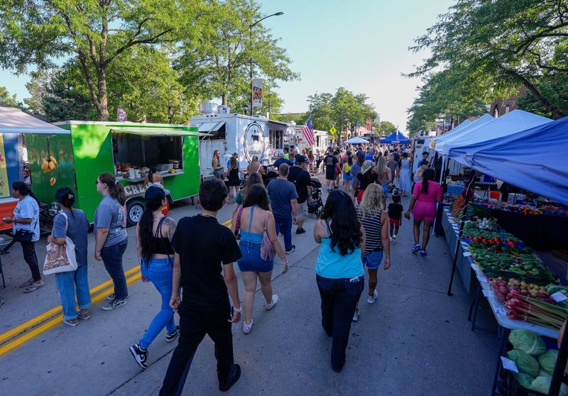 Marketgoers walk through the Farmers' Market on Broadway on Wednesday, July 29, 2026, along Broadway in Green Bay, Wisconsin. 
Tork Mason/USA TODAY NETWORK-Wisconsin