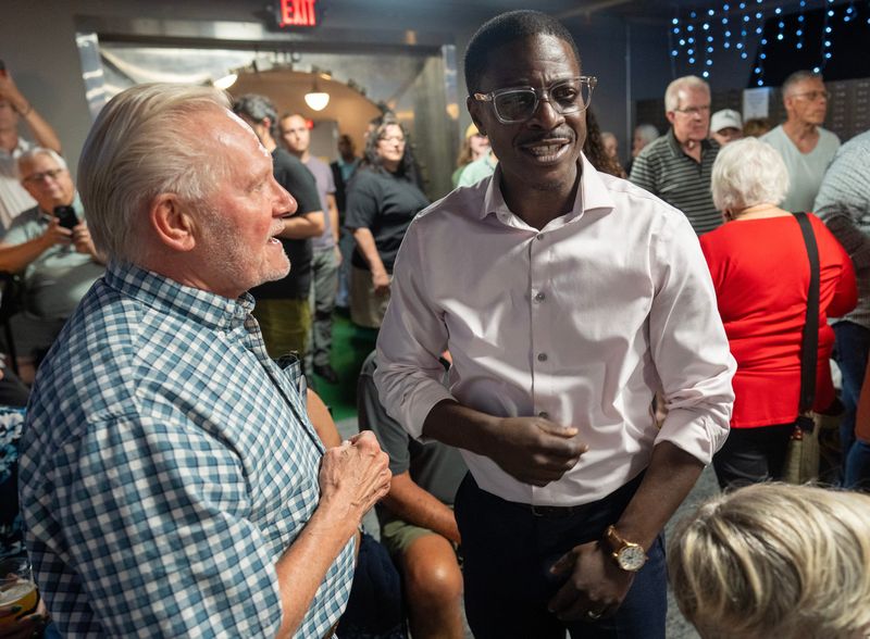 Milwaukee County Executive David Crowley, right, speaks at a campaign appearance Monday, August 3, 2026 in Appleton, Wisconsin. Crowley reentered Wisconsin's Democratic gubernatorial primary with the support of Gov. Tony Evers.