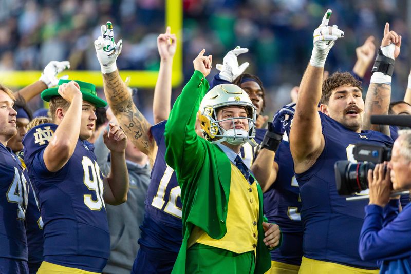Oct 11, 2025; South Bend, Indiana, USA; The Notre Dame Leprechaun wears a gold helmet during the Alma Mater after beating the NC State Wolfpack at Notre Dame Stadium. Mandatory Credit: Michael Caterina-Imagn Images