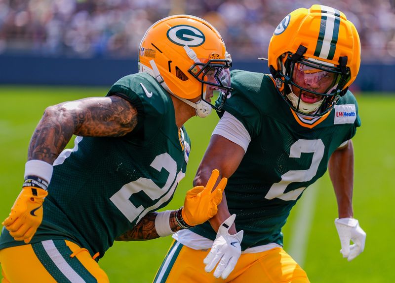 Green Bay Packers cornerbacks Domani Jackson (20) and Brandon Cisse (2) run through a drill during practice on Tuesday, Aug. 4, 2026, at Ray Nitschke Field in Ashwaubenon, Wisconsin. 
Tork Mason/USA TODAY NETWORK-Wisconsin