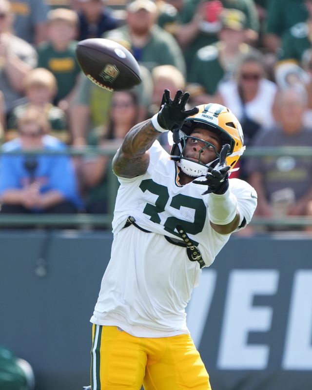 Green Bay Packers running back MarShawn Lloyd (32) catches a pass during the sixth day of training camp on Aug. 4, 2026, at Ray Nitschke Field in Ashwaubenon, Wis.