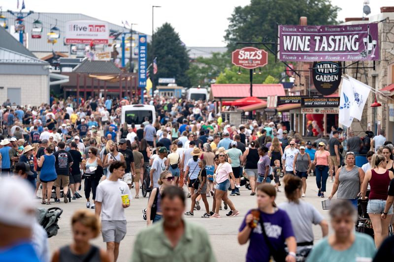 Fairgoers flock to the Wisconsin State Fair Park for opening day on Aug. 6, 2026 in West Allis, Wisconsin.