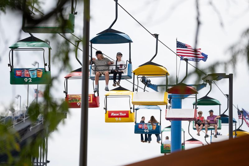 State fair attendees ride the SkyGlider at the Wisconsin State Fair Park on opening day Aug. 6, 2026 in West Allis, Wisconsin.