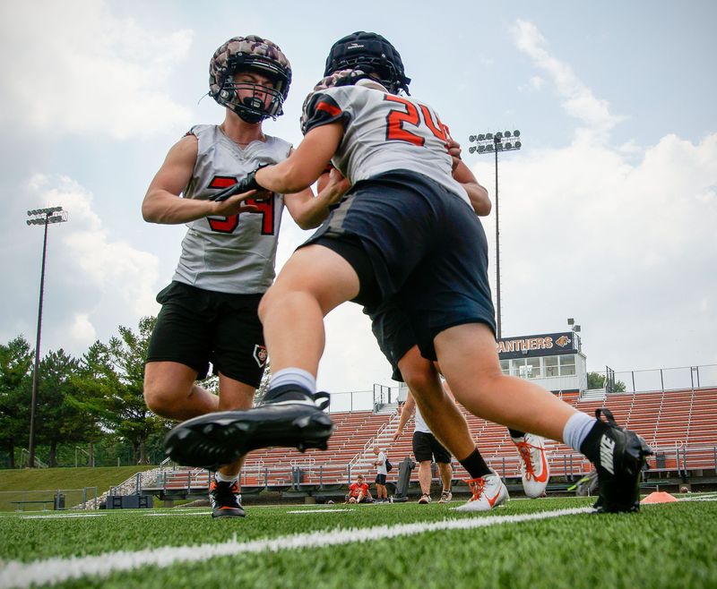 Plymouth players practice blocking during practice, Thursday, August 6, 2026, in Plymouth, Wis.