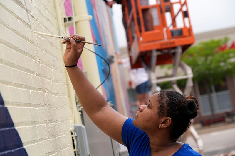 Appleton West High School student Juliana Basubi participates in the fifth annual Paint the City Mural Project Friday, August 7, 2026, in Appleton, Wisconsin. Paint the City is a two-week public art program where students work alongside professional mural artist Neo Medina to design and paint a nearly 3,000-square-foot mural at Spats Food & Spirits on College Avenue.