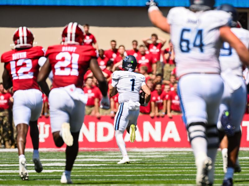 Aug 30, 2025; Bloomington, Indiana, USA; Old Dominion Monarchs quarterback Colton Joseph (1) runs for a touchdown against the Indiana Hoosiers during the first half at Memorial Stadium. Mandatory Credit: Robert Goddin-Imagn Images