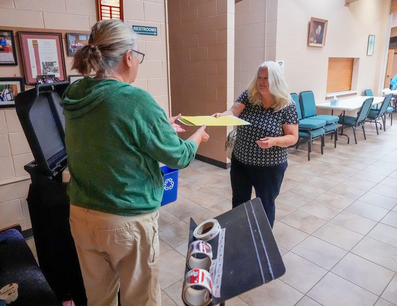 A voter submits her ballot on Tuesday, Aug. 11, 2026, at Cavalry Lutheran Church in Green Bay, Wisconsin. 
Tork Mason/Green Bay Press-Gazette