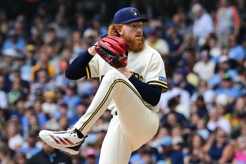 Milwaukee Brewers starting pitcher Dustin May (21) throws a pitch in the first inning against the Pittsburgh Pirates at American Family Field in Milwaukee, Wisconsin.