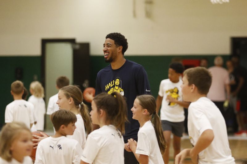 Tyrese Haliburton shares a moment with campers at the CareSource Tyrese Haliburton Camp on Friday, Aug. 14, 2026.