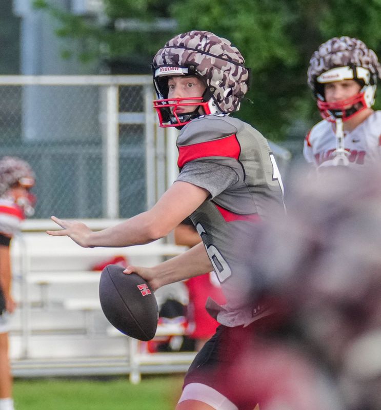 Hamilton quarterback Cole Erdmann looks downfield during preseason football practice Aug. 6 in Sussex.