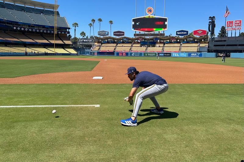Milwaukee Brewers infielder Jonathan Ornelas takes grounders before facing the Los Angeles Dodgers on Aug. 15 at Dodger Stadium.