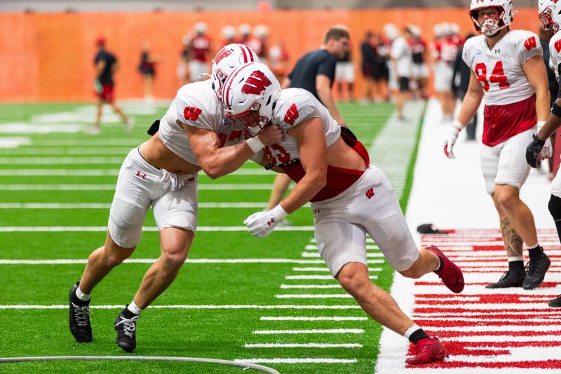 Wisconsin tight ends Emmett Bork (left) and Grant Stec (right) participate in a drill during a practice at the Kellner Family Athletic Center in Madison on Aug. 18, 2026.