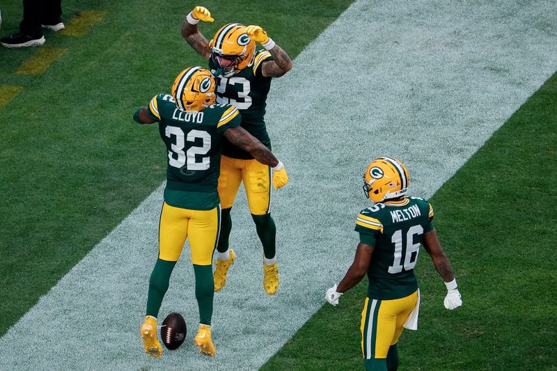 Aug 21, 2026; Denver, Colorado, USA; Green Bay Packers running back Marshawn Lloyd (32) celebrates his touchdown with wide receiver Skyy Moore (23) and wide receiver Bo Melton (16) in the first quarter against the Denver Broncos at Empower Field at Mile High. Mandatory Credit: Isaiah J. Downing-Imagn Images