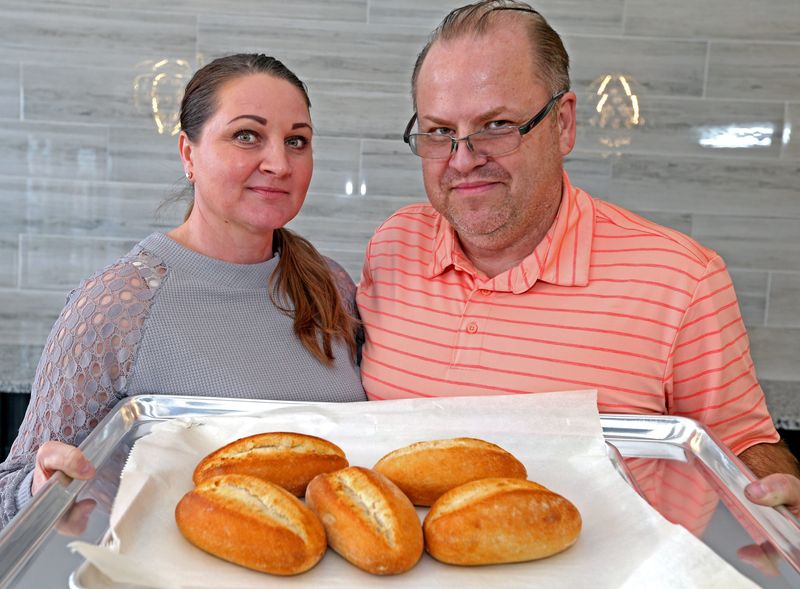 Wioletta and Adam Bartoszek from Poland hold traditional rolls on Wednesday, March 2, 2022. Wioletta's Polish Kitchen is opening in Oak Creek on Oct. 15, 2025.